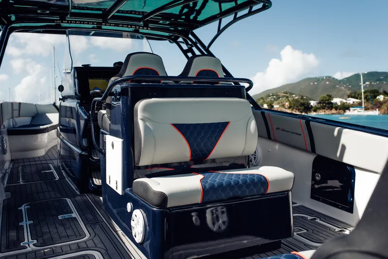 Slide: The Image of 2014 Midnight Express 37' Open boat interior with luxury seating and sleek design. - 11