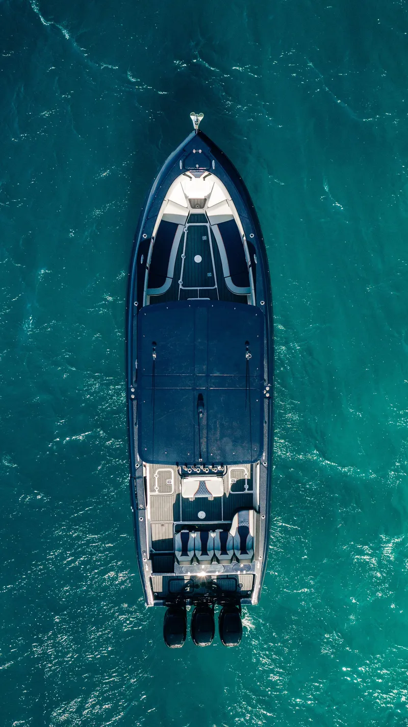 Slide: The Image of Aerial view of 2014 Midnight Express 37' Open boat on turquoise water. - 5