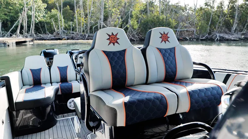 Slide: The Image of Luxurious seating on a 2014 Midnight Express 37' Open boat, featuring stylish upholstery. - 9