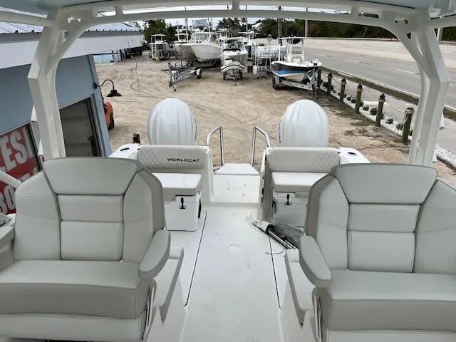Slide: The Image of 2025 World Cat 296 DC boat interior with plush seating and dual engines. - 4