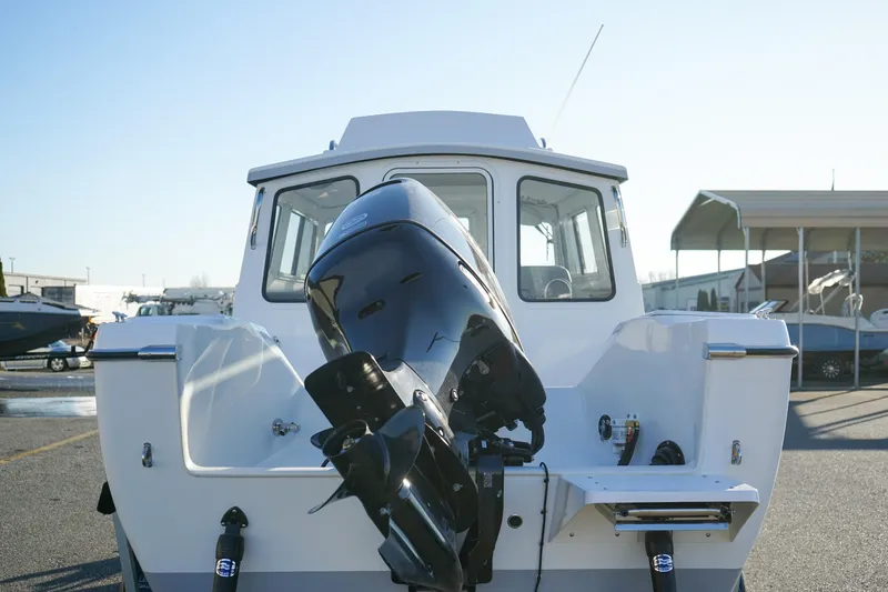 Slide: The Image of 2025 C-Dory 22' Cruiser boat with outboard motor, rear view. - 4