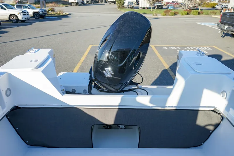 Slide: The Image of 2025 C-Dory 22' Cruiser with outboard motor in a parking lot. - 8