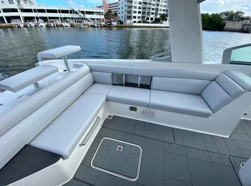 Slide: The Image of 2024 Aviara AV32 OB boat with sleek seating and modern design on the water. - 11