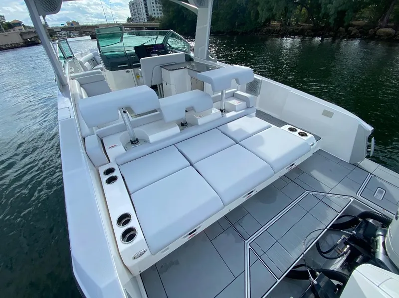 Slide: The Image of 2024 Aviara AV32 OB luxury boat with spacious seating and sleek design on the water. - 2