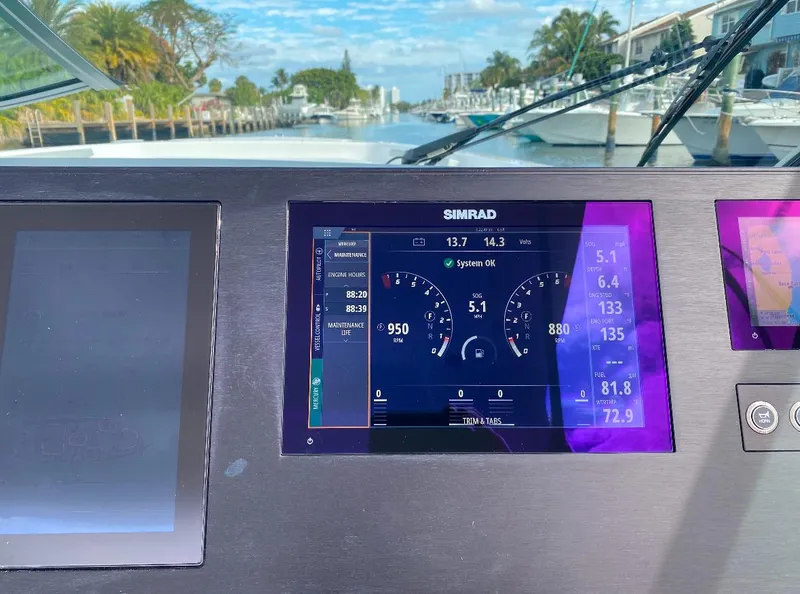 Slide: The Image of 2024 Aviara AV32 OB dashboard with Simrad display, showing navigation and engine data. - 20