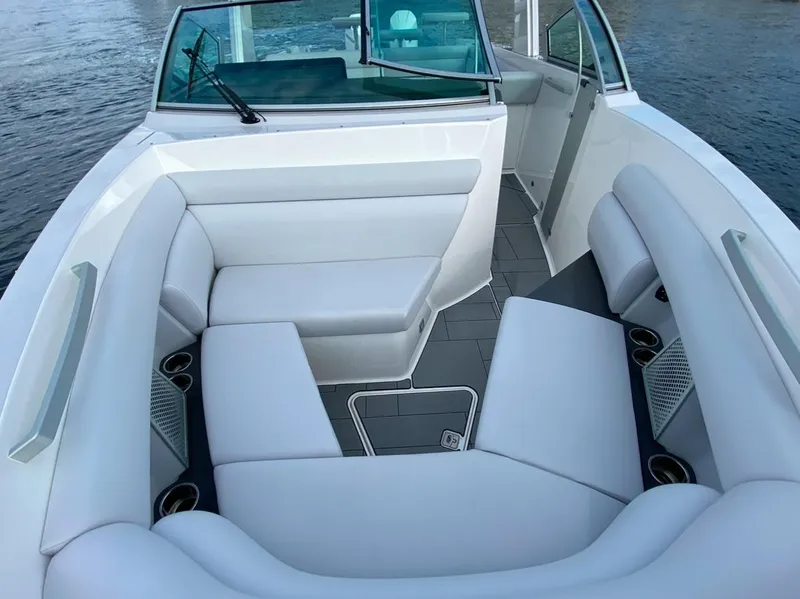 Slide: The Image of 2024 Aviara AV32 OB boat interior with white seating and cup holders. - 22