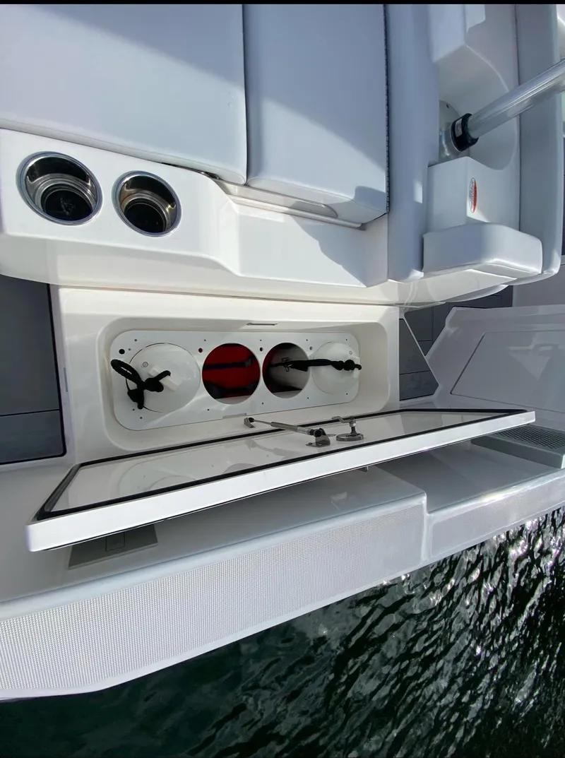 Slide: The Image of 2024 Aviara AV32 OB boat with open storage compartment, sleek design, and modern features. - 8
