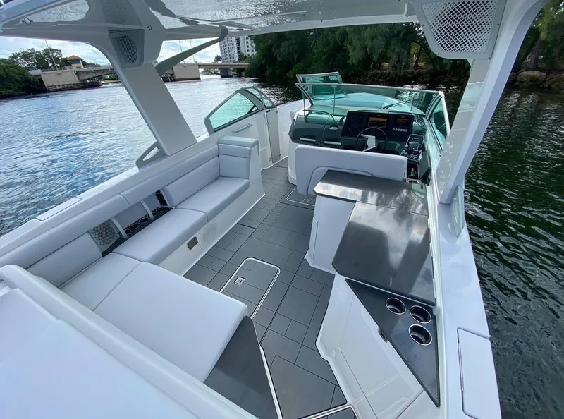 Slide: The Image of 2024 Aviara AV32 OB luxury boat interior with sleek seating and modern helm. - 9