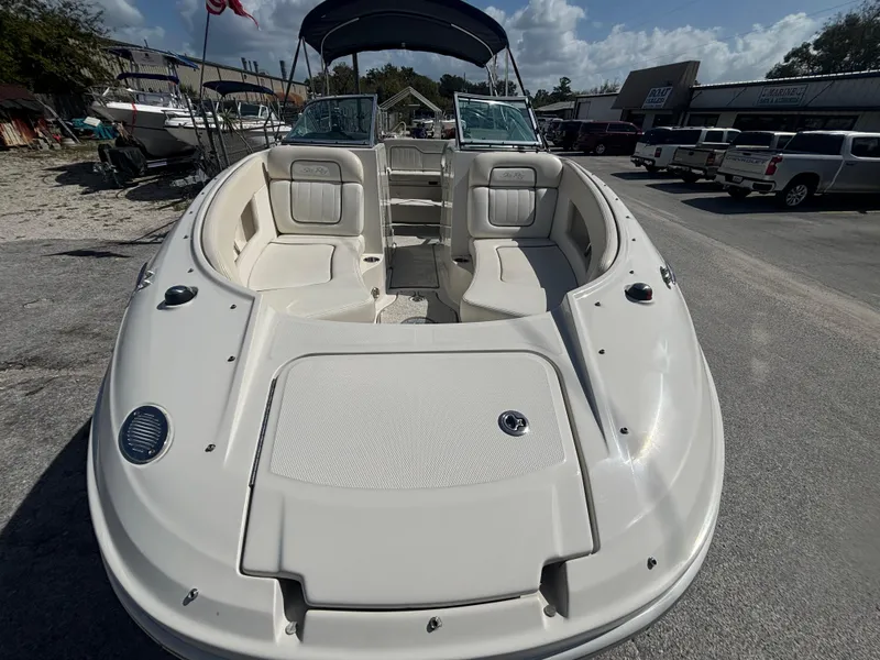 Slide: The Image of 2008 Sea Ray 230 Sundeck boat with spacious seating and sleek design. - 10