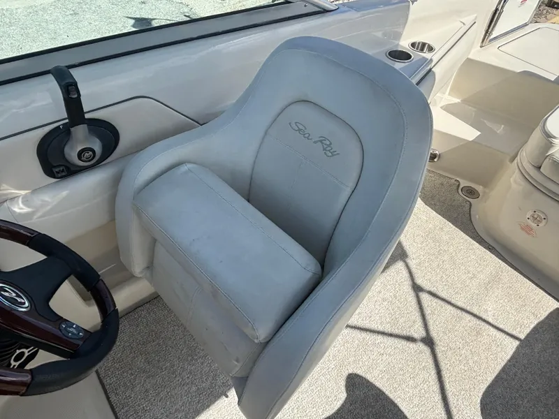 Slide: The Image of Captain's seat on a 2008 Sea Ray 230 Sundeck boat, featuring a sleek design. - 24