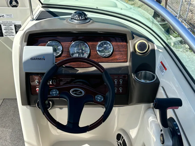 Slide: The Image of Dashboard of a 2008 Sea Ray 230 Sundeck with Garmin navigation system. - 28