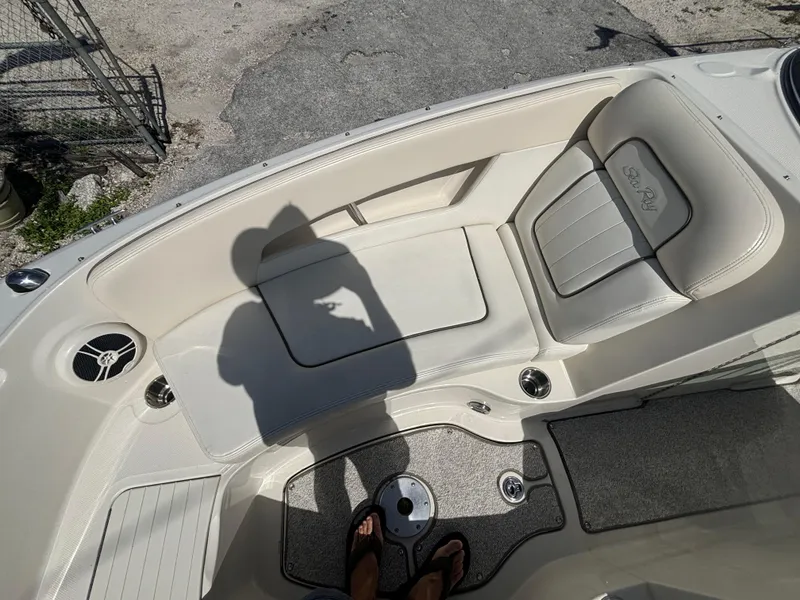 Slide: The Image of 2008 Sea Ray 230 Sundeck interior with seating and speaker, shadow visible. - 35