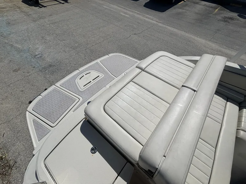 Slide: The Image of 2008 Sea Ray 230 Sundeck boat with white leather seating and swim platform. - 41