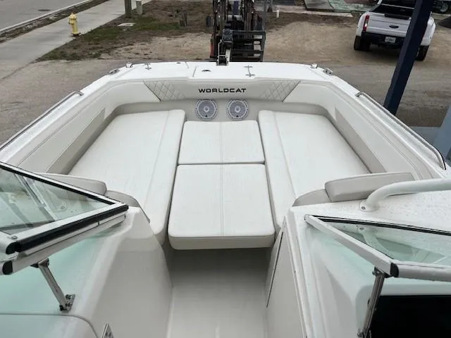 Slide: The Image of 2025 World Cat 230 SD boat interior with white seating and speakers. - 3