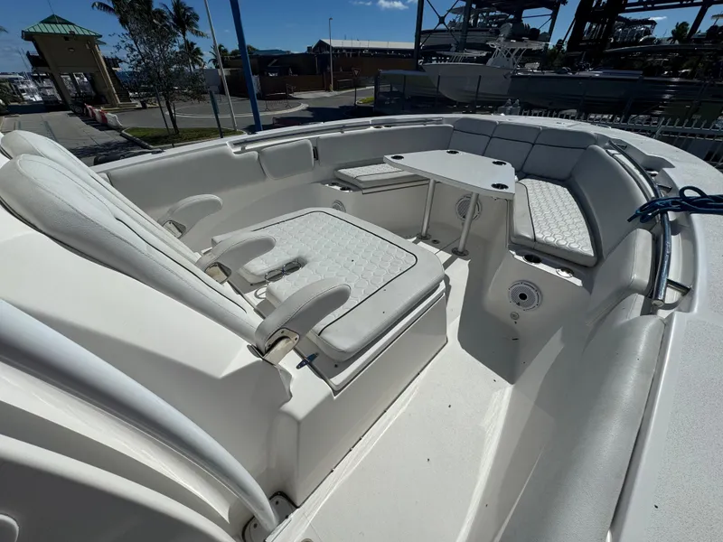 Slide: The Image of 2021 Sea Fox 328 Commander boat interior with white seating and table. - 3