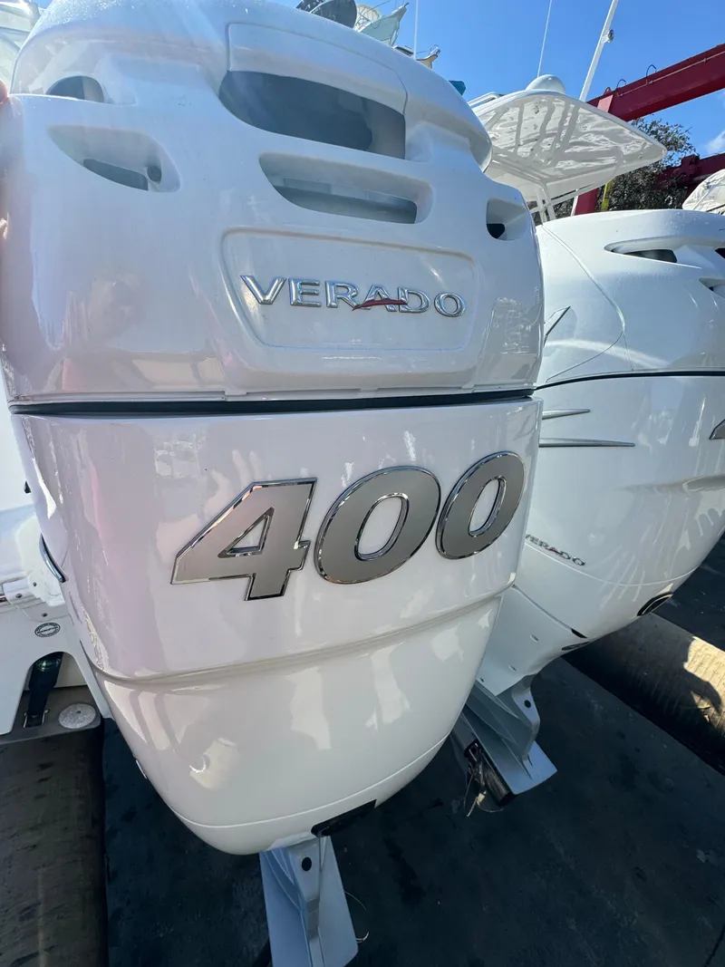 Slide: The Image of Certainly! Here's a short description for the image:
"Close-up of a 2023 Sea Fox 3s outboard motor with '400' marking." - 8