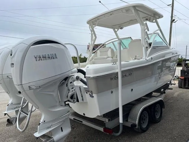 Slide: The Image of 2025 World Cat 230 DC boat with Yamaha engines on a trailer. - 3