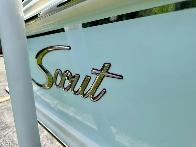 Slide: The Image of Close-up of 2023 Scout 215 Dorado boat logo on the side. - 10
