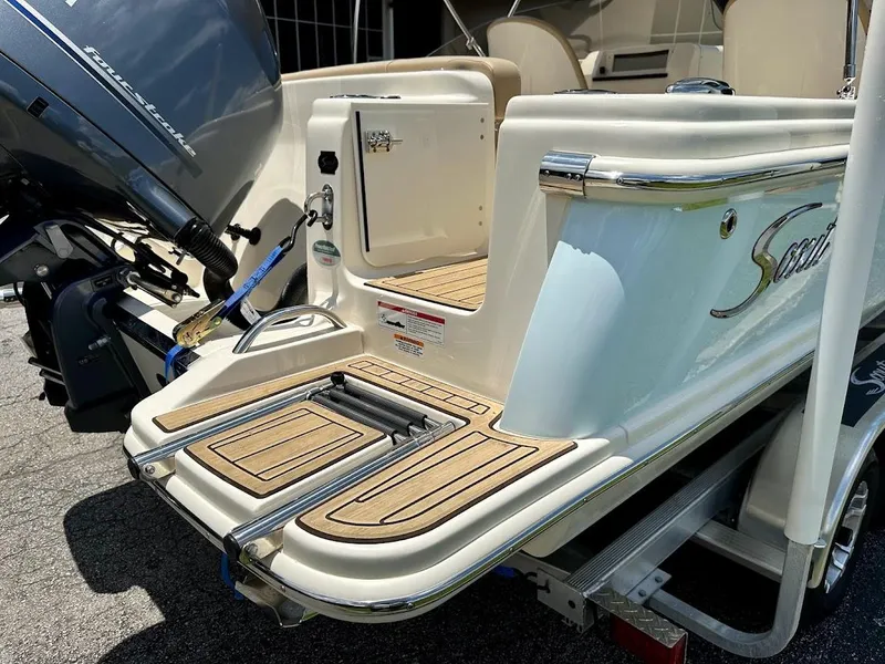 Slide: The Image of 2023 Scout 215 Dorado boat with swim platform and outboard motor. - 12