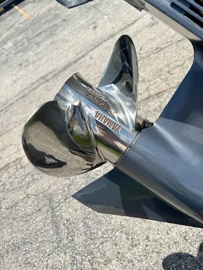 Slide: The Image of 2023 Scout 215 Dorado boat with Yamaha propeller, close-up view. - 14