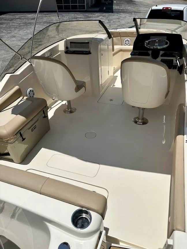 Slide: The Image of 2023 Scout 215 Dorado boat interior with seating and helm. - 22
