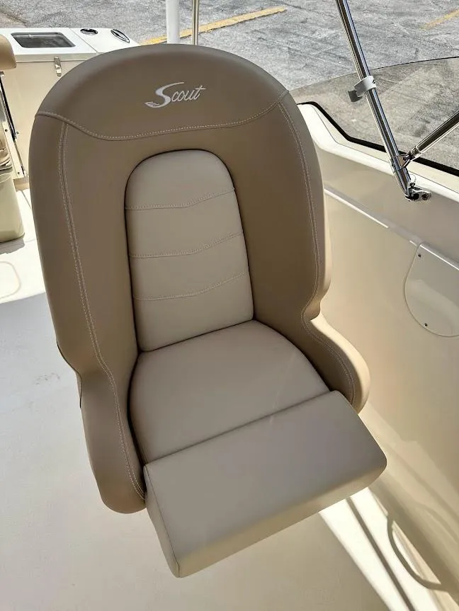 Slide: The Image of 2023 Scout 215 Dorado boat seat, beige upholstery, sleek design. - 31