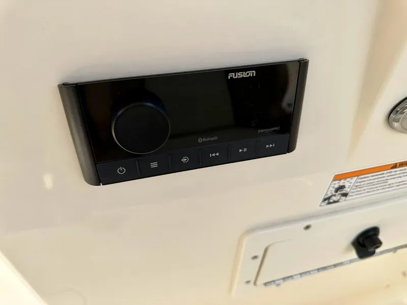 Slide: The Image of Fusion audio system on 2023 Scout 215 Dorado boat dashboard. - 34