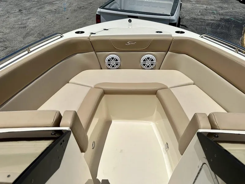Slide: The Image of 2023 Scout 215 Dorado boat interior with beige seating and speakers. - 41
