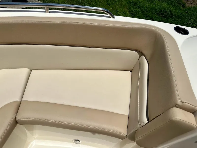 Slide: The Image of 2023 Scout 215 Dorado boat interior seating with beige upholstery. - 42
