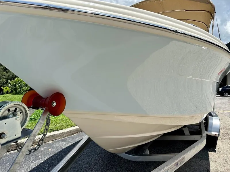 Slide: The Image of 2023 Scout 215 Dorado boat on trailer, side view, sunny day. - 7