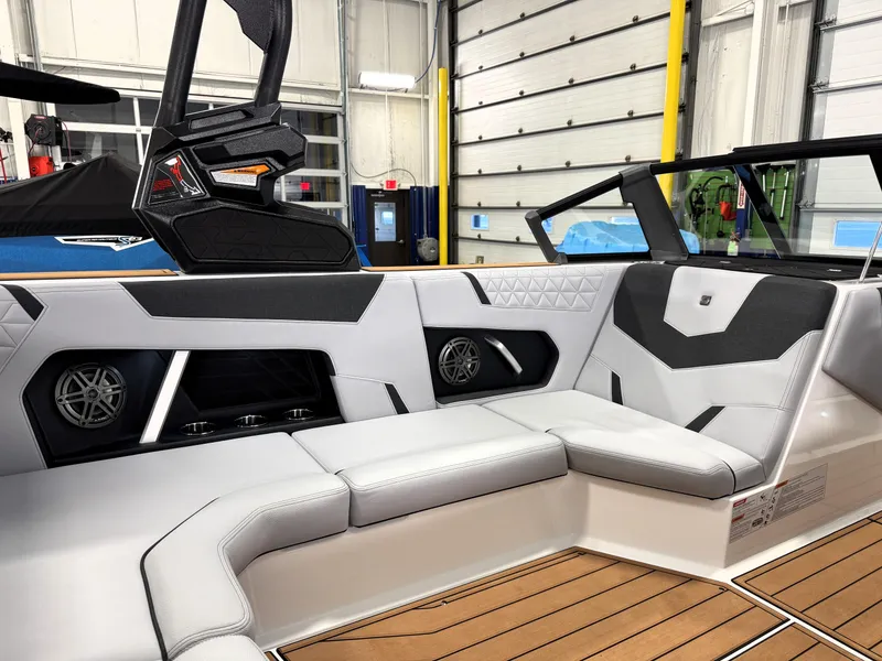 Slide: The Image of 2025 Nautique Super Air Nautique GS20 interior with sleek seating and modern design. - 21