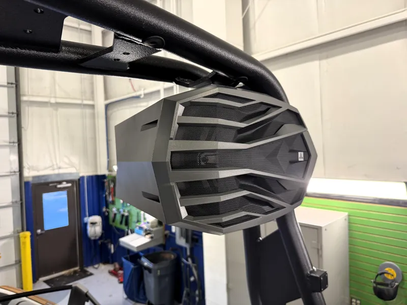 Slide: The Image of Close-up of a speaker on a 2025 Nautique Super Air Nautique GS20 boat. - 23