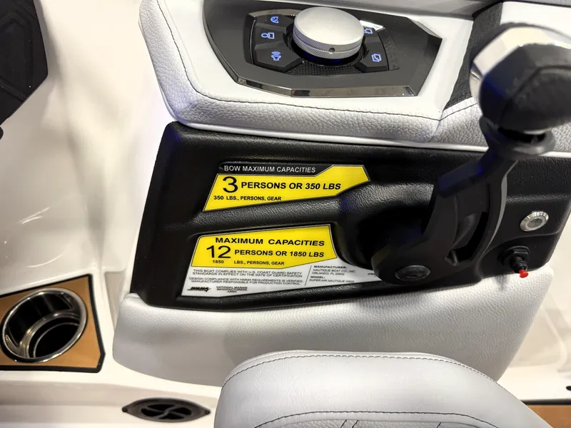 Slide: The Image of 2025 Nautique Super Air Nautique GS20 control panel with capacity labels for passengers. - 24