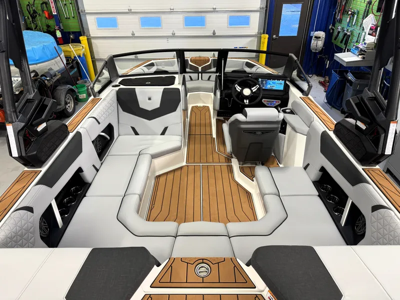 Slide: The Image of 2025 Nautique Super Air Nautique GS20 interior with sleek seating and modern dashboard. - 4