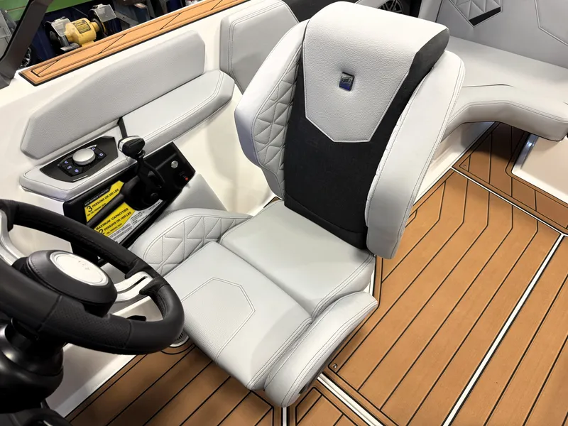 Slide: The Image of 2025 Nautique Super Air Nautique GS20 interior with modern helm and luxurious seating. - 8