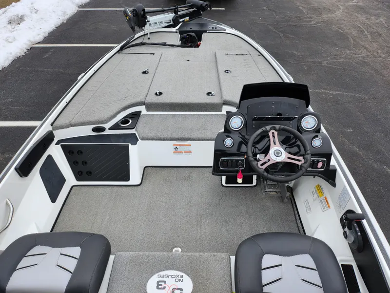 Slide: The Image of 2016 Nitro Z18 boat interior with steering wheel and seating. - 11