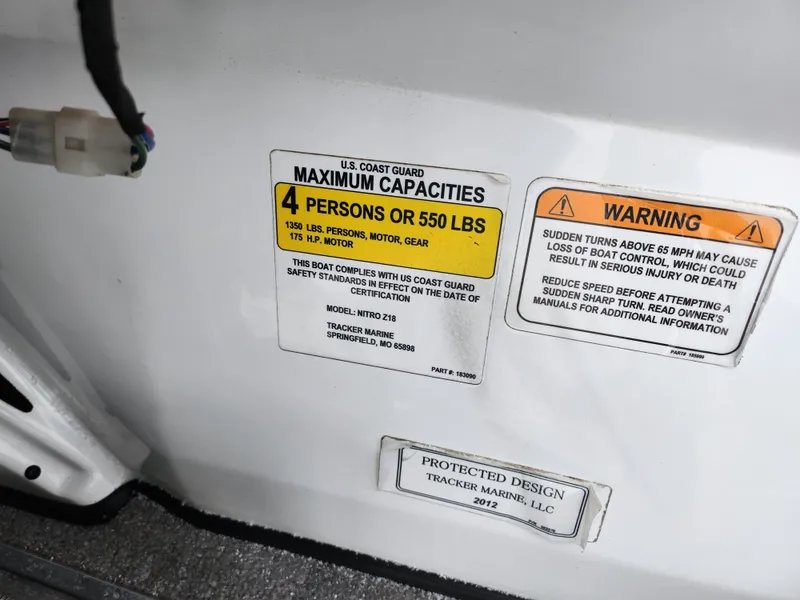 Slide: The Image of Safety labels on a 2016 Nitro Z18 boat, indicating capacity and warning information. - 13