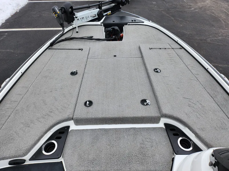 Slide: The Image of 2016 Nitro Z18 boat deck with gray carpet and storage compartments. - 14