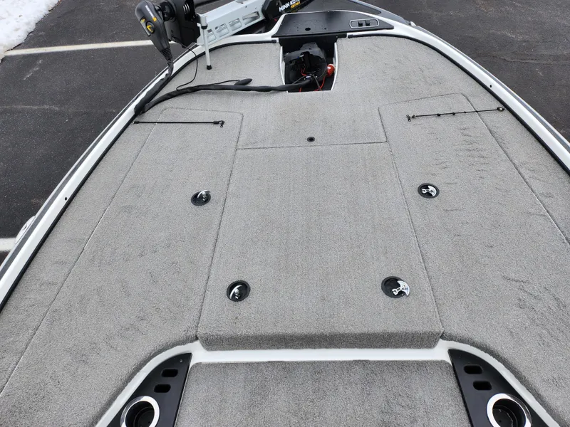Slide: The Image of 2016 Nitro Z18 boat deck with storage compartments and trolling motor. - 16