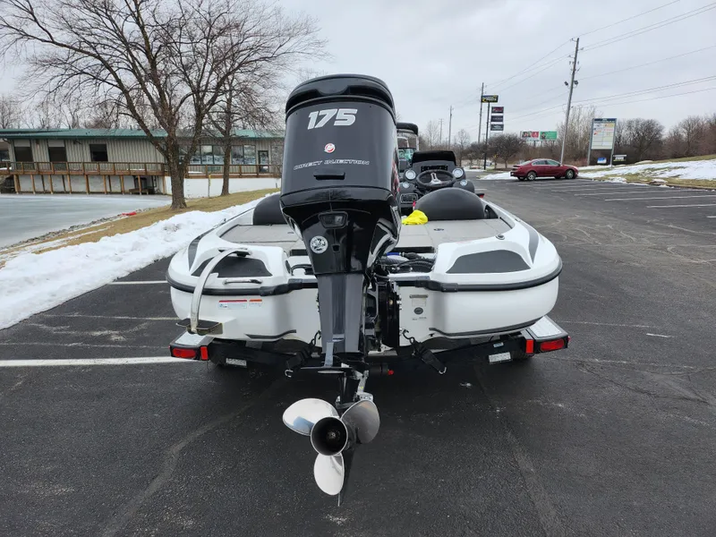 Slide: The Image of 2016 Nitro Z18 boat with 175 horsepower engine, parked on snowy pavement. - 2