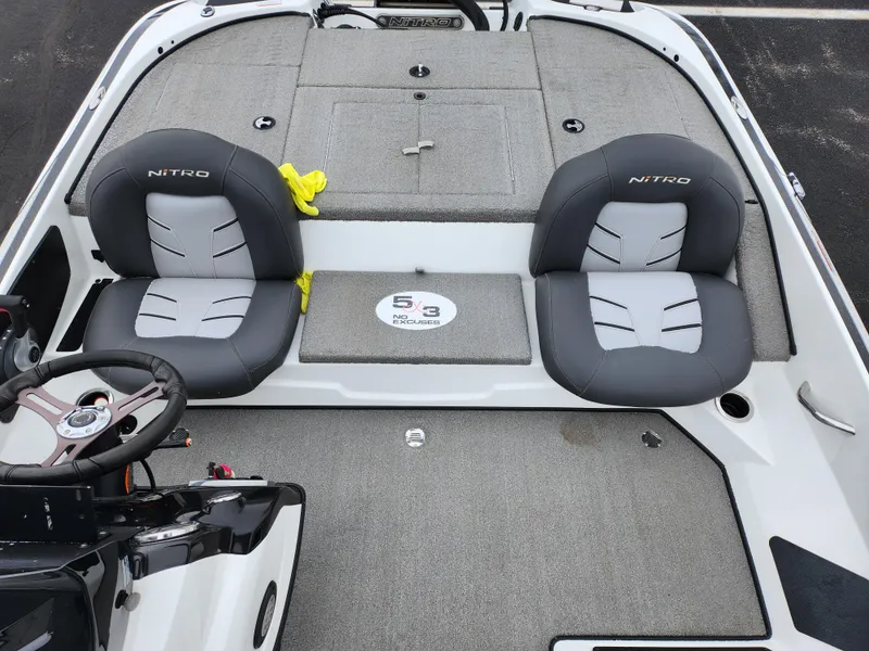 Slide: The Image of 2016 Nitro Z18 boat interior with dual seats and steering wheel. - 20