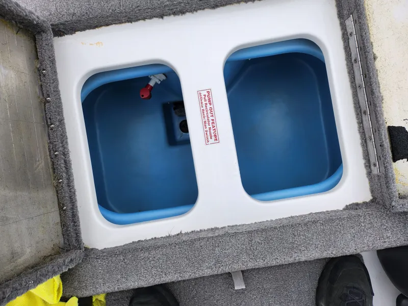 Slide: The Image of Livewell compartments in a 2016 Nitro Z18 boat, featuring dual blue basins. - 22