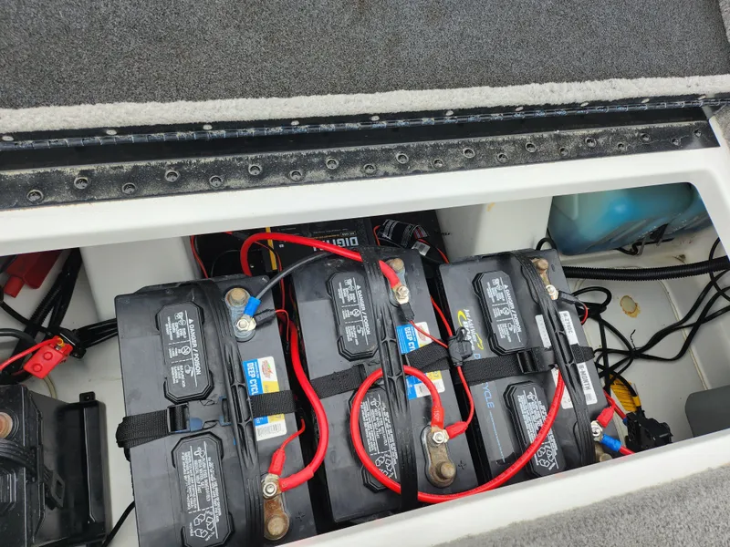 Slide: The Image of Batteries in a 2016 Nitro Z18 boat compartment with red and black cables. - 24