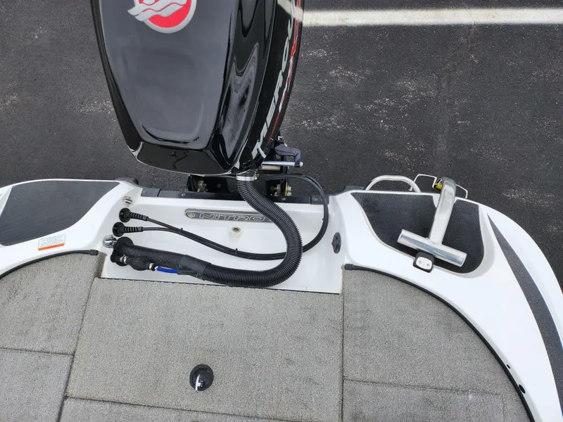Slide: The Image of 2016 Nitro Z18 boat deck with motor and control cables. - 25