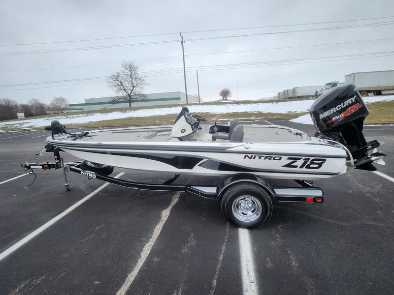 Slide: The Image of 2016 Nitro Z18 boat with Mercury engine in a parking lot. - 4
