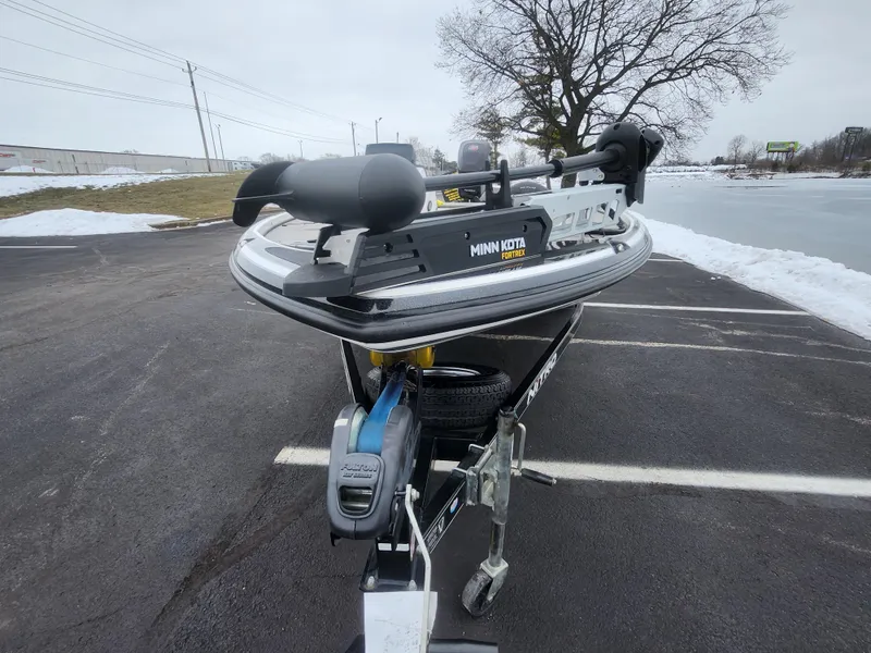 Slide: The Image of 2016 Nitro Z18 boat with Minn Kota trolling motor in snowy parking lot. - 7