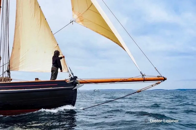 Slide: The Image of Sailing on a 1903 Morecambe Bay Prawner 38' with traditional sails on open water. - 4