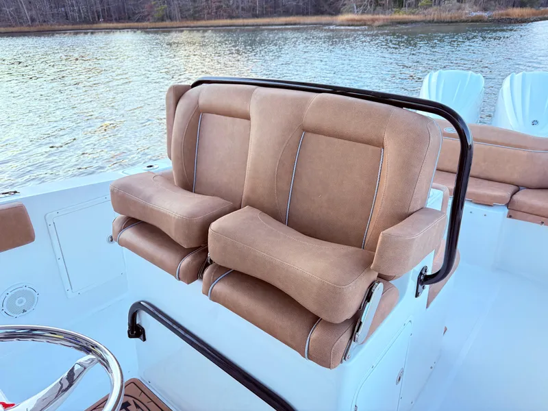 Slide: The Image of 2023 Sea Hunt Ultra 305 SE boat seats with water view. - 11