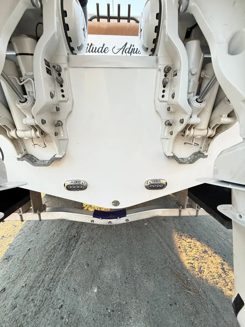 Slide: The Image of 2023 Sea Hunt Ultra 305 SE boat hull and engine mounts, viewed from below. - 26