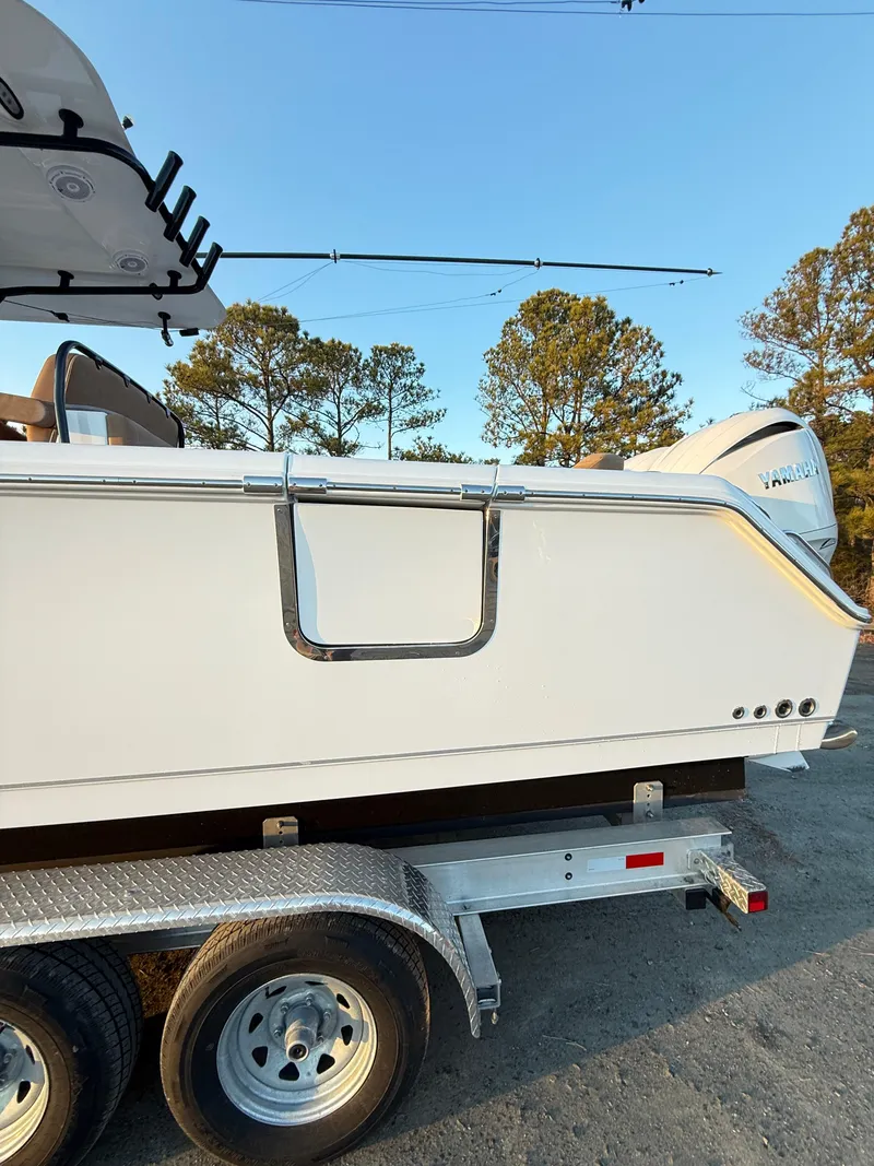 Slide: The Image of 2023 Sea Hunt Ultra 305 SE boat on trailer, side view, outdoors. - 33